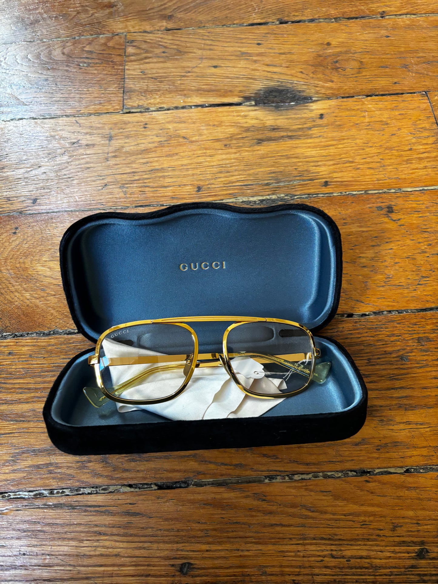 Gucci gold frame glasses